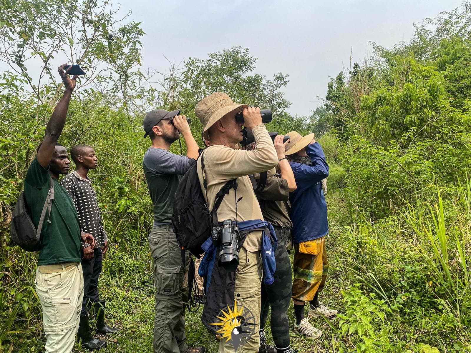 tourists on a walk in bigodi wetland